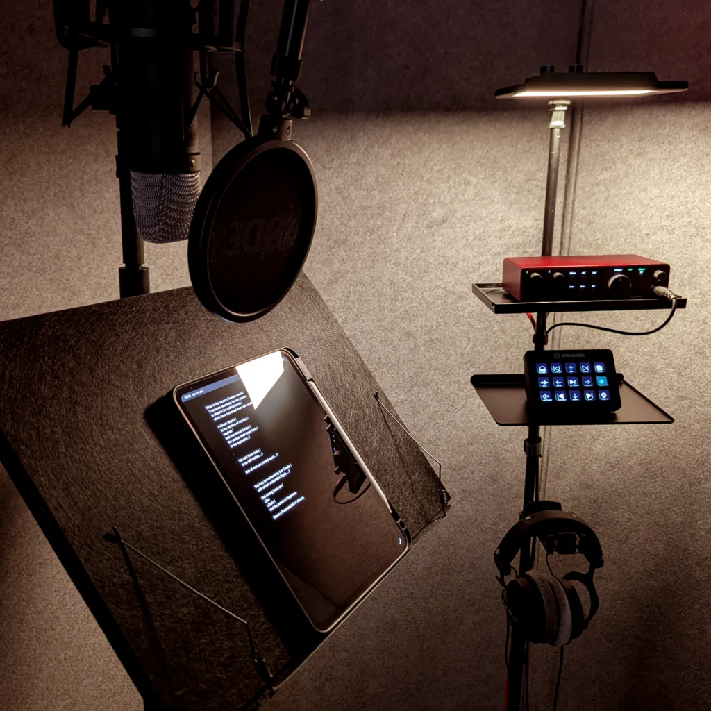 Rodney Young voiceover recording studio with Rode NT1 microphone, pop filter, acoustic panels, and professional audio interface